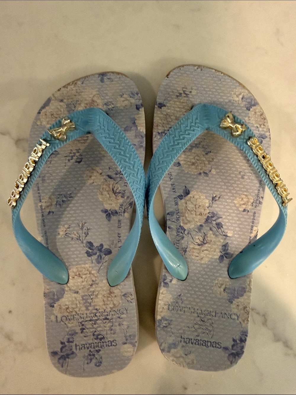 Havaianas Women’s Light Blue Floral Flip Flop Sandals with Gold Accents